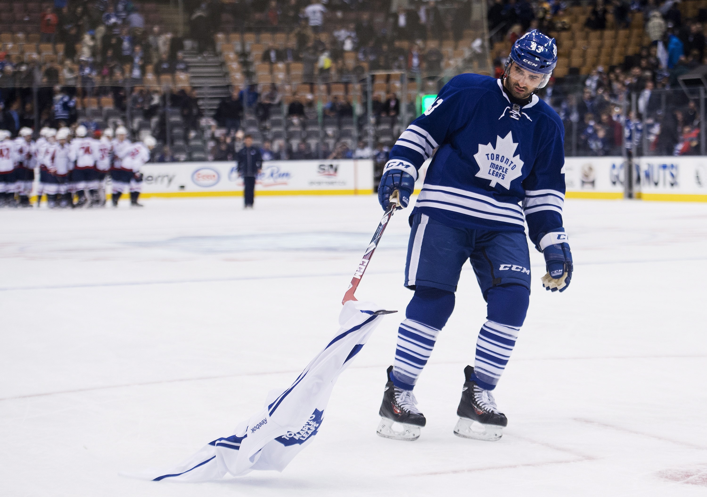 Toronto Maple Leafs forward Nazem Kadri picks up a Maple Leafs jersey on the ice after being defeated buy the Washington Capitals during third period NHL hockey action in Toronto on Wednesday, January 7, 2015. THE CANADIAN PRESS/Nathan Denette